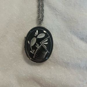 Vintage silver tone and black enamel locket pendant and chain.